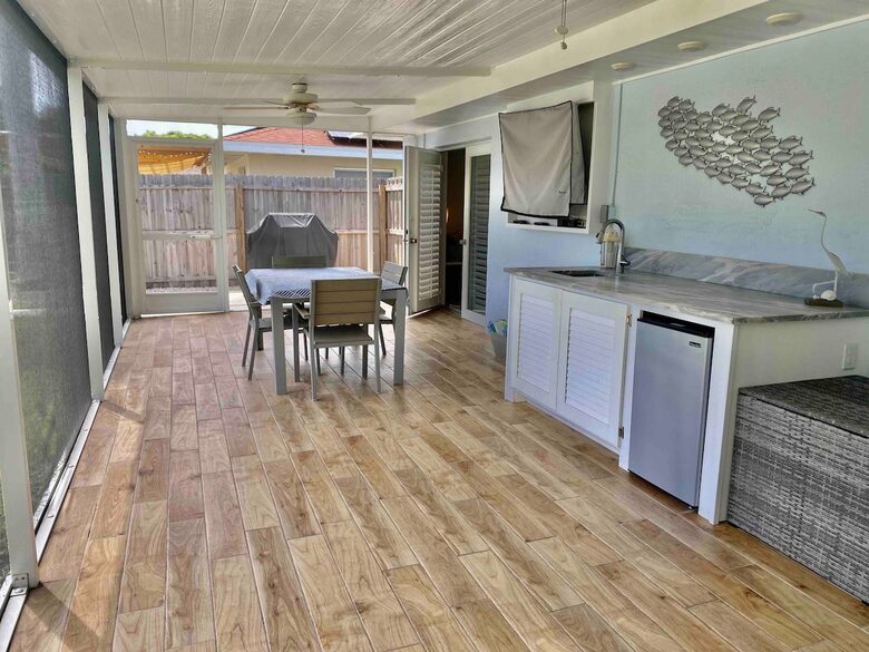 Outdoor living with grill, wet bar , grill, TV and eating area