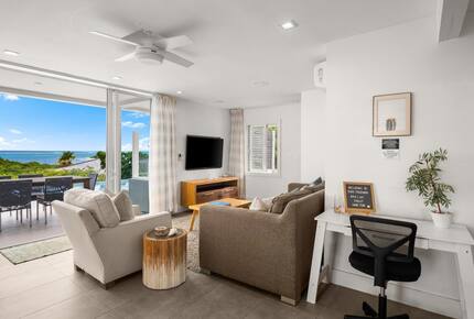 Living room opens to patio and pool deck