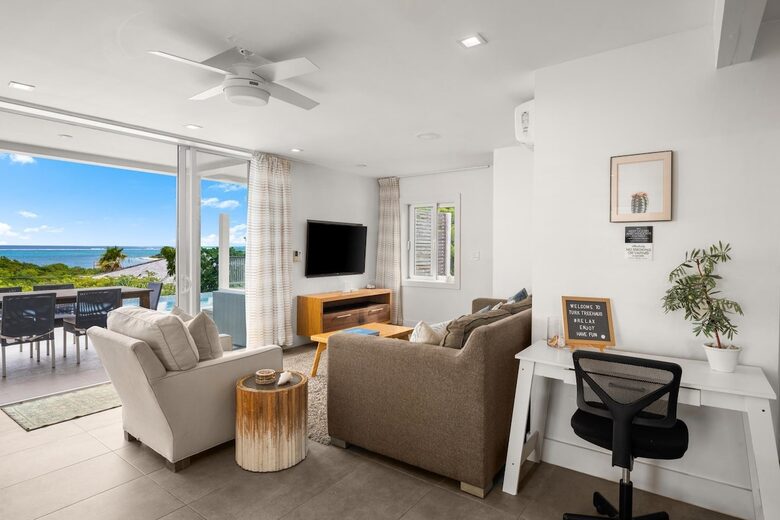 Living room opens to patio and pool deck