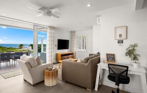 Living room opens to patio and pool deck