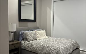 Downstairs bedroom with queen and bathroom with shower