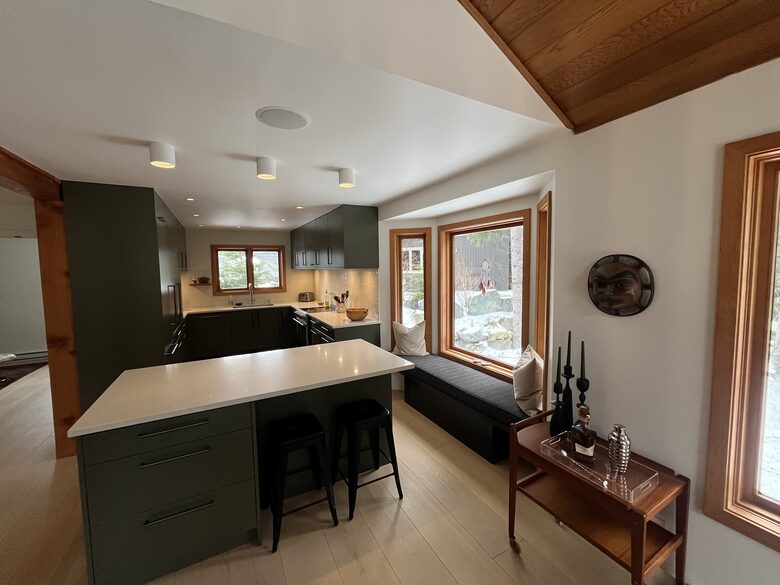 Chef’s kitchen with induction stove, dishwasher, built in fridge.