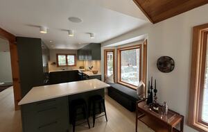 Chef’s kitchen with induction stove, dishwasher, built in fridge.