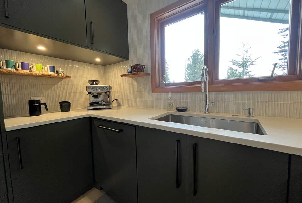 Coffee station with Breville espresso maker.