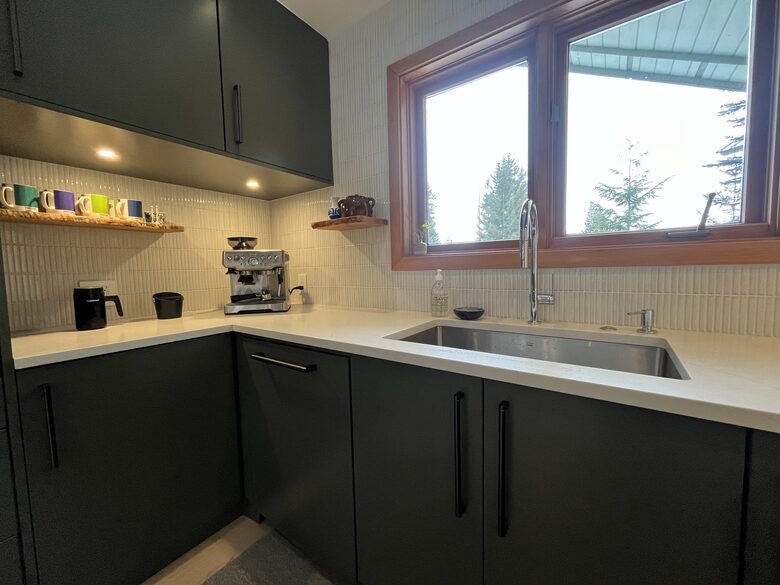 Coffee station with Breville espresso maker.