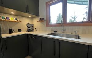 Coffee station with Breville espresso maker.