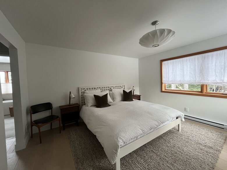 Primary bedroom with king sized bed and ensuite bath.