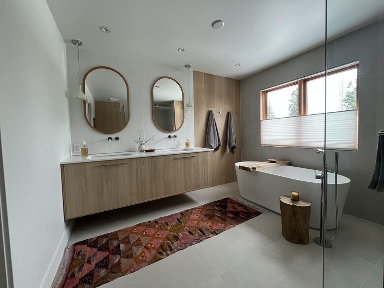 Primary ensuite bathroom with double vanity, soaker tub & shower.