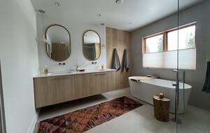 Primary ensuite bathroom with double vanity, soaker tub & shower.
