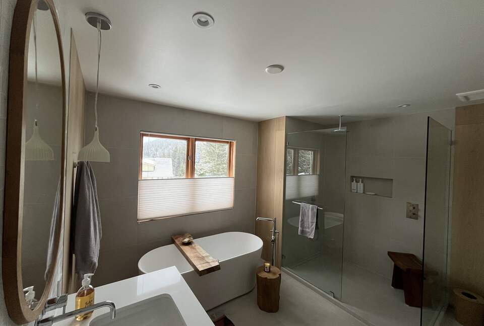 Primary ensuite bathroom with double vanity, soaker tub & shower.