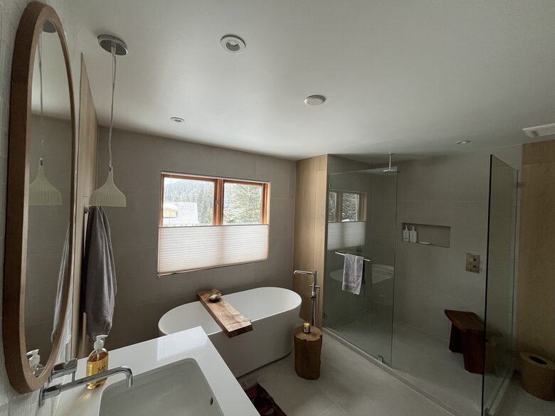 Primary ensuite bathroom with double vanity, soaker tub & shower.