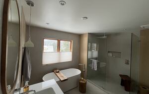 Primary ensuite bathroom with double vanity, soaker tub & shower.