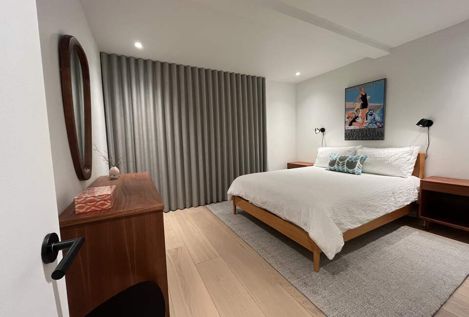 1st floor bedroom with Queen bed and access to lower deck (hot tub).