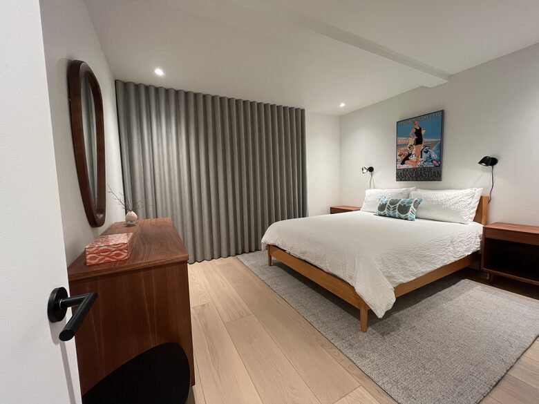 1st floor bedroom with Queen bed and access to lower deck (hot tub).