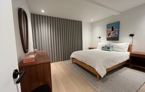 1st floor bedroom with Queen bed and access to lower deck (hot tub).