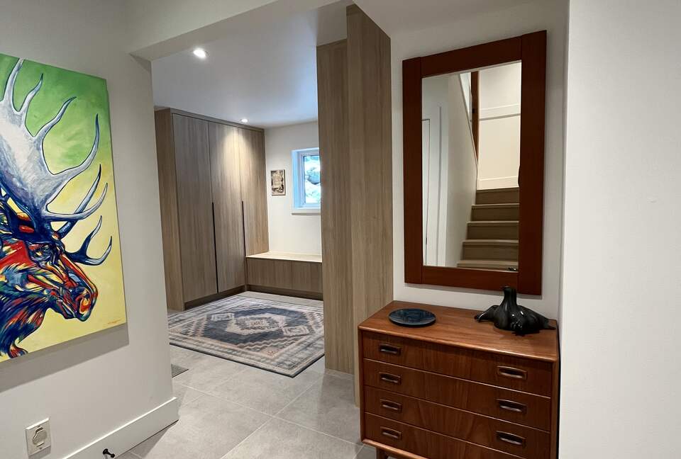 Entry with new laundry centre and closets.