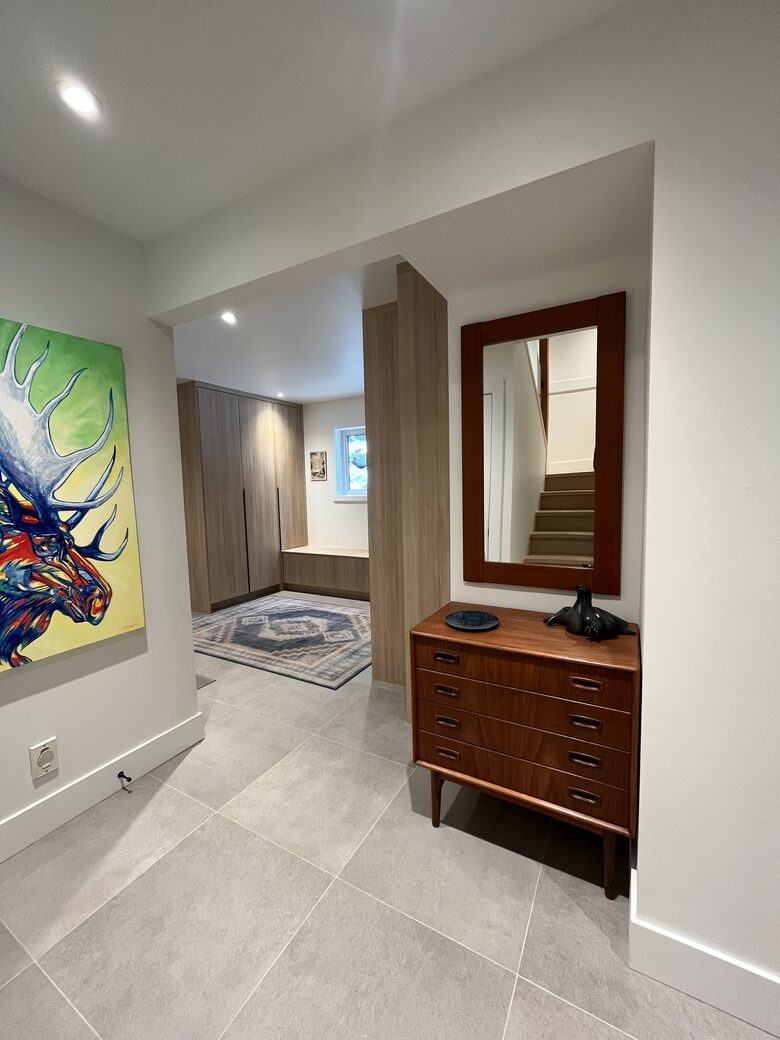 Entry with new laundry centre and closets.