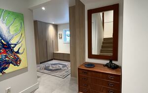 Entry with new laundry centre and closets.