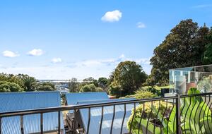 Sun-filled balcony with views across the coastline.