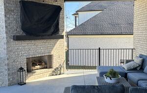 Upper patio with fireplace and TV
