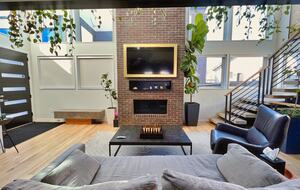 View of the frame tv from behind living room sofa