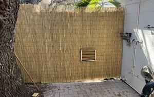Outdoor shower and courtesy bench.