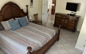 Master bedroom with flat screen.