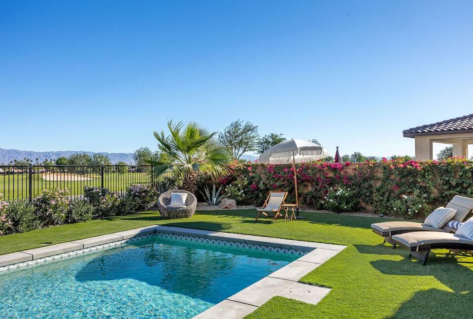 Lush green yard with pool and spa overlooking Stadium, PGA WEST