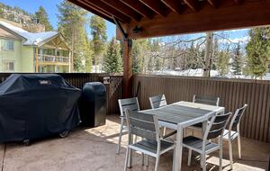 Large outdoor patio with 2 grills and a fire pit