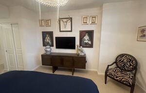 Master bedroom tv and artwork