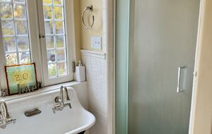 The trough sink looks out over the front yard