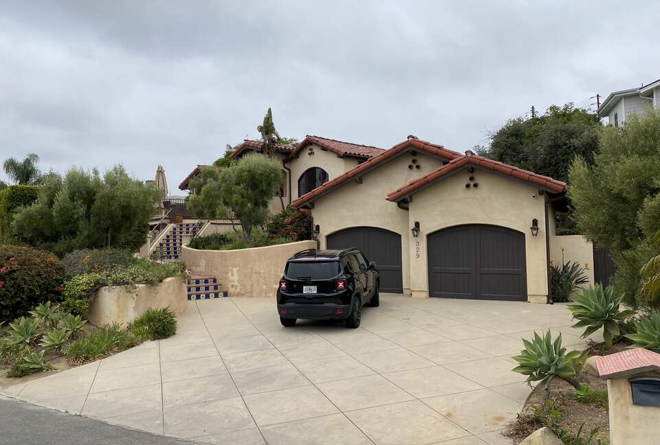 Street view; driveway holds two guest cars plus owners car on occasion