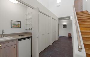 Bar. Stairs to upstairs living area and bedroom.