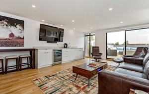 Top floor wet bar with refrigerator for beverages and coffee bar
