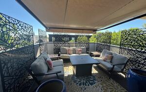 Top floor outdoor space with fire pit