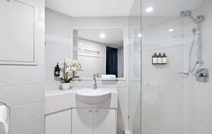 Bathroom ensuite with plush towels and organics