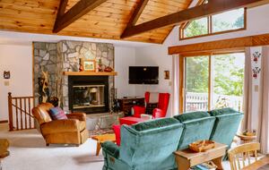 Family room with high ceilings and beams