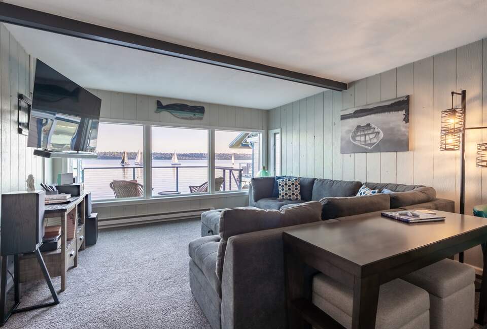 Cozy living room with a wood fireplace and views.