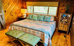 Bedroom #2 on main level with forest views