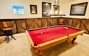 Billiard table with custom tin paneling