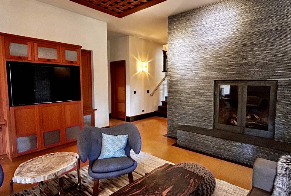 Media room with fireplace and access to hot tub