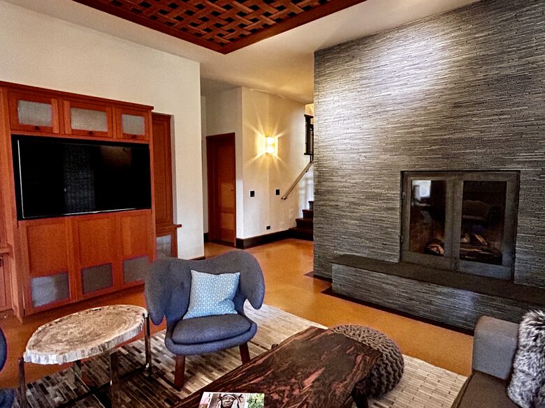 Media room with fireplace and access to hot tub