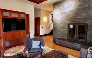 Media room with fireplace and access to hot tub