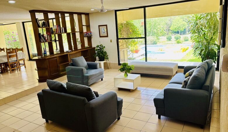 Living room with Pool views