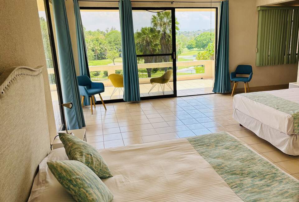 Master bedroom with balcony golf course views