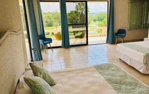 Master bedroom with balcony golf course views