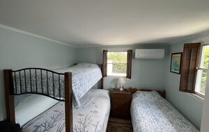 Bunk room with 2 twins and one full bed