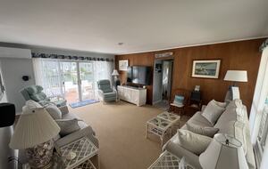 Living room with 65” TV and surround sound music system