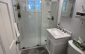 Bathroom with shower. Home has an enclosed outdoor shower as well.