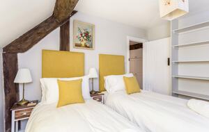 Yellow bedroom as a twin